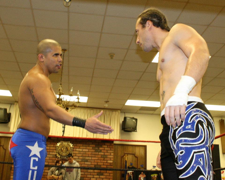 Ricky Reyes and Kevin Tibbs share an awkward show of respect before their match