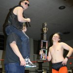 King EJ Risk on the shoulders of Xander Page to shout at the crowd