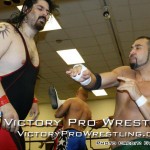 Mike Magnum delivers a hard right to Xander Page, moments before Xander Page threw him outside the ring